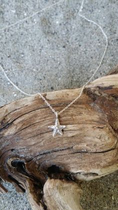 "Tiny sterling silver starfish pendant. The sterling silver charm is a dainty 9mm with a shiny finish. It has a delicate sterling silver chain and clasp. Shown here in 17\" length. *If you are unsure of the length you need, or would like to wear this item at different lengths, we now offer an adjustable length option! You can add an adjustable end to your necklace using this link: https://www.etsy.com/listing/791277751/necklace-extension-added-to-your All items are gift wrapped and shipped witho Sterling Silver Starfish Charm Pendant Necklace, Sterling Silver Starfish Necklace With Star Charm, Silver Starfish Charm Necklace In Sterling Silver, Ocean-inspired Sterling Silver Charm Necklaces, Sterling Silver Pendant Necklace With Starfish Charm, Sterling Silver Necklace With Starfish Charm, Ocean-inspired Silver Sterling Charm Necklaces, Silver Sterling Necklace With Starfish Charm, Silver Necklace With Sterling Silver Starfish Charm