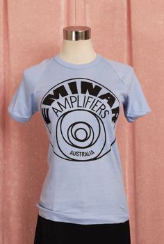 Vintage 70s/80s Eminar Amplifiers tshirt super soft Label: exacto tops Size on Label :14 Best Fit:AU8 - AU10 Measurements in CENTIMETRES with the garment lying flat:          Shoulder to shoulder 24 Length :59 Bust :38 Waist :35 Sleeve :10 Condition :like new Stretch :Heaps! ** MEASUREMENTS ARE BEST COMPARED AGAINST A SIMILAR ITEM OF CLOTHING ** Measurements are taken along one side of garment lying flat (double for all the way round measurements). 'Best fit' is an approximation in AUSTRALIAN SIZING; be sure to check over measurements carefully All our items are measured in CENTIMETRES with the measurements clearly stated in the description, As most items are handmade sizes can slightly differ so please carefully check the measurements before ordering as we do not refund size issues. Blue Vintage, Red And White Stripes, 1980s Vintage, Black Polka Dot, Vintage 70s, White Stripe, Nice Dresses, Vintage Outfits, Gender Neutral