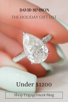 a woman's hand holding an engagement ring with the words under $ 120