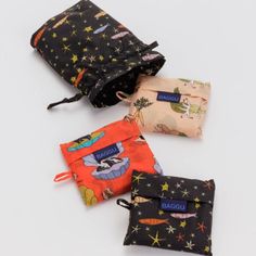 A set of Standard Baggus in a reusable drawstring pouch. Each set contains three unique prints, ideal for gifting. Each bag carries 2-3 plastic grocery bags worth of stuff comfortably in hand or over your shoulder Each holds up to 50lbs Each folds into its own flat 5" × 5" pouch Bags measure 25 ½" × 15 ½" × 6" each Pouch measures 6 ½" × 5" × 2 ¼" Recycled ripstop nylon Machine washable Baggu Tote, Pouch Bags, Plastic Grocery Bags, Scrap Material, I Love My Dad, Grocery Bags, Unique Prints, Carrier Bag, Drawstring Pouch