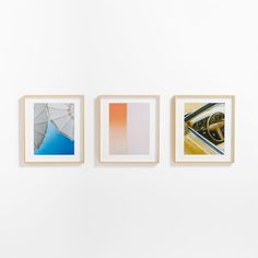 three framed photographs hang on the wall next to each other