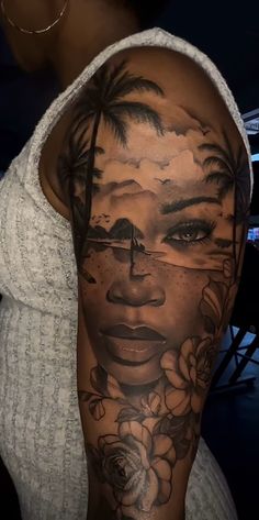 a woman's face with flowers and palm trees on her arm