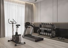 there is a gym with exercise equipment in the room and mirrors on the wall behind it