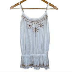 Womens Small White Bohemian Tank Top By Passport New Without Tags Tan Embroidery With Beads Adjustable Spaghetti Straps One Strap Is Twisted Buttons On Left Side Measurements Laid Flat Armpit To Armpit 12.5” Length 18” 100% Cotton Smoke Free Pet Friendly Home Paswhttnks Summer Embellished Embroidered Top, White Beaded Bohemian Tops, Embroidery With Beads, White Bohemian, Beaded Embroidery, White Tops, Pet Friendly, Spaghetti Strap, Spaghetti