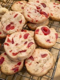 some cookies are on a cooling rack and one is filled with strawberry shortbreads