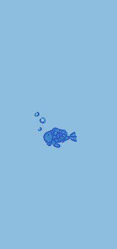 a blue fish floating in the water with bubbles on it's back legs and head