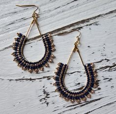 Handmade with miyuki delica seed beads woven around a tear drop gold earring finding. Gold Teardrop Earrings With Tiny Beads, Gold Teardrop Beaded Earrings With Tiny Beads, Bohemian Gold Beaded Teardrop Earrings, Seed Bead Earring, Woven Earrings, Bead Earring, Bead Stitching, Beaded Hoops, Navy Gold