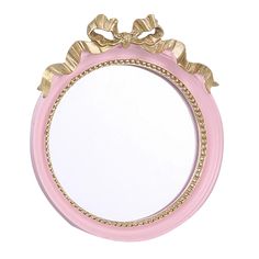 a pink and gold mirror with bows on the top is shown against a white background