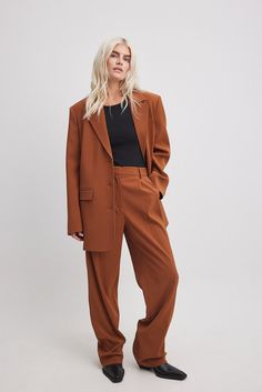 These suit pants feature a waistband with belt loops and a zipper, hook and button closure. They have a pleat detail on the front and 2 front pockets. These suit pants feature 2 mock back pockets and wide, straight legs. Inseam length in size 36: 80 cm / 31.49 in. Madewell Pant Suit, Suits Straight Pants, Rust Long Pants, Straight Leg Pant Suit Women, Cognac Effortless Pant, Suits For Women Straight Leg, Women’s Suit Pants Wide Leg, Rust Pants Women, Womens Suits Wide Leg