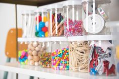 the shelves are filled with different types of candy