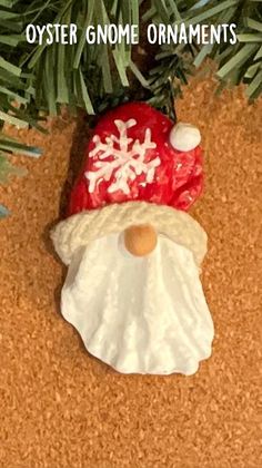 a santa clause ornament hanging from a christmas tree on a cork board floor