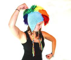 This is a one of a kind baby blue and rainbow earflap hat. The color scheme was inspired by The My Little Pony Friendship Is Magic character, Rainbow Dash and all the bronies/ bronys who watch the show . It has ear flaps and tassels that hang down and a fringe Mohawk down the center. It has been crochet with super thick and warm red yarn. It is double threaded and super warm. It has a lot of charm and spunk.one size fits most. It's thick and warm, cozy and cool! Would make a great girlfriend or Fun Multicolor Costume Hats And Headpieces, Playful Blue Hat As A Gift, Playful Blue Hats For Gifts, Playful Blue Hat As Gift, Playful Blue Hat For Gift, Blue Adjustable Fun Costume Hats And Headpieces, Fun Blue Adjustable Costume Hats And Headpieces, Fun Blue Hats For Gifts, Fun Blue Hat For Gift