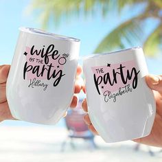 two people holding up wine glasses with the words, wife of the party written on them