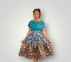 This is a 3-tiered Dress with 3 different matching African Prints. It is about colorful, fun and comfortable! Great for summer time and ideal will for your special event, or regular outing. The dress has 2 inner pockets for more comfort and practicality. Dress on Model is available and ready to be shipped. Model is 5.0ft and wears a US Medium. On request, this style can be custom made to your size and fabric preference. Just get in touch.  We will do all we can to ensure you love your dress and promptly address any additional requests you may have. Thanks in advance for your order! Multicolor Tiered Dress With Ruffles, Fitted Multicolor Tiered Maxi Dress, Fitted Multicolor Tiered Midi Dress, Flowy Multicolor Tiered Skirt Dress, Multicolor Floral Print Tiered Dress, Bohemian Tiered Dress With Short Sleeves, Bohemian Short Sleeve Tiered Dress, Bohemian Multicolor Tiered Summer Dress, Multicolor Bohemian Tiered Summer Dress