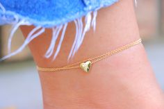 "🧡 Jewelry is one of the most beautiful things in the material world. For those interested in fashion, jewelry is like art. Our jewelry collection can bring out the best of your dresses and help you to shine bright as the sun. Heart Charm Anklet, Gold Ankle Bracelet, Beach Wear Anklet, Summer Anklets, Gift for Her, Gold Chain Anklet, Initial Letter Anklet, Anklets Color: Gold Length: 8.5\"+2\" extender (Adjustable) Metal: 14K Gold Plated Clasp: Lobster ✅ Fast Shipping ✅ All of our jewelry are hypoallergenic and tarnish resistant. ✅ Our jewelry comes in beautiful packaging and you can include gift message for your loved one. 💖 Thank you for your support and trust. If you have any issue with our jewelry items contact us. We will provide you the best solution by replacing with new item or f Handmade Trendy Gold Anklets, Trendy Handmade Gold Anklets, Gold Chain Anklet, Minimalist Anklet, Initial Anklet, Anklet Gold, Anklets For Women, Heart Anklet, Summer Anklets