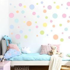 a child's bedroom with polka dot wall decals