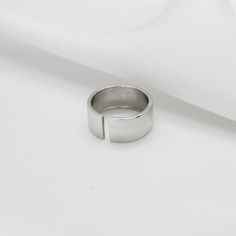 Dimensions Ring width: 8mm Wide wedding ring in 925 sterling silver. Excellent wide slotted ring that allows you to adjust it exactly to your finger size. This ring can be used both as an engagement ring and for every day. Silver plated with rhodium, this protects the ring from wear and gives it a shine. Rhodium is harmless to the skin. Wedding Ring Wide Band - Sterling Silver Band Ring - Statement Ring - Open Band Ring - 925 Silver Wide Band Ring - Gift For Her - Minimalist Wide Wedding Rings, Graduation Rings, Twisted Band Ring, Wide Band Ring, Sterling Silver Rings Bands, Twisted Band, Wide Band Rings, Domed Ring, Silver Band Ring