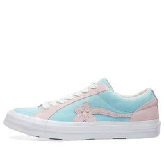 The Golf Le Fleur x Converse One Star Ox 'Plume' is the latest release from Tyler, the Creator and Converse. This sneaker features a suede upper in Plume with Pink Marshmallow overlays. The flower pattern One Star on the side panel is a signature detail, while white contrast stitching and white leather lining complete the look. The vulcanized rubber midsole is white, and the flower motif continues on the footbed and outsole. Tyler, the Creator's unique style comes through in every detail of this shoe, and it's sure to turn heads wherever you go! (SNKR) Converse Suede Skate Shoes For Streetwear, Converse Low-top Suede Sneakers, Sporty Suede Converse Sneakers, Converse Pink Leather Sneakers, Converse Suede Sneakers, Casual Converse Suede Skate Shoes, Golf Le Fleur Converse, Converse Golf Le Fleur, Pink Marshmallow