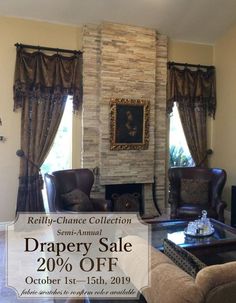 a living room filled with furniture and a fire place in front of a stone fireplace