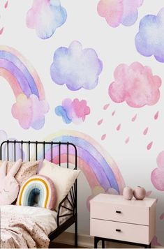 a child's bedroom with pink, purple and blue clouds painted on the wall