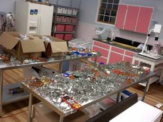 a room filled with lots of glassware and boxes