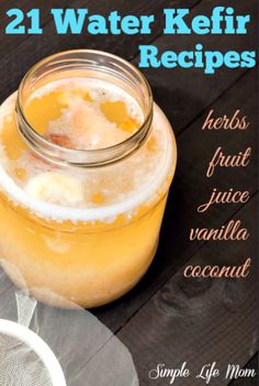 a jar filled with liquid sitting on top of a wooden table