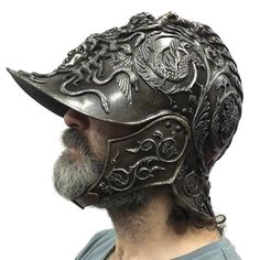 a man wearing a helmet with intricate designs on it