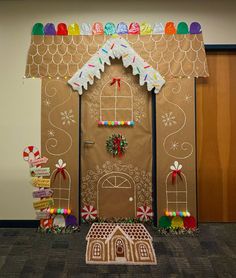 a gingerbread house decorated with candy and decorations