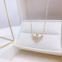 Dainty Angel Wings Necklace – Gemi Glitz Gold Dainty Crystal Necklace With Cubic Zirconia, Gold Dainty Cubic Zirconia Crystal Necklace, Dainty Gold Crystal Necklace With Cubic Zirconia, Silver-plated Stainless Steel Necklace, Rose Gold Clavicle Chain Crystal Necklace, Rose Gold Crystal Necklace With Clavicle Chain, Gold Rhinestone Necklace With Delicate Chain As Gift, Rose Gold Cubic Zirconia Chain Necklace As A Gift, Rose Gold Cubic Zirconia Chain Necklace Gift