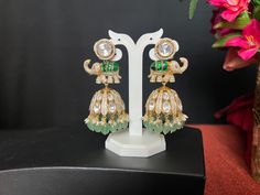 Jadau Kundan AD Moissanite Elephant Jhumka Earrings/ 3 Inches Long/wide 1.3 Inch/Kundan Green Stone/Mint  Green Beads Pearl Drop/Gold Finish These fabulous Earrings are high-quality and will match with a number of outfits. Wear them for any occasion, or give them as a gift.  DETAILS: Includes Two Earrings only. Length: 3.0 Inches Long  wide ; 1 i.3 Inch Wide  Weight for Earring Set: 2.10 oz ( 60 g) Earring backs Push to on/off.  Material: Imitation gold Finish/ Pachi Kundan green, AD Moissanite Green Chandbalis For Reception And Festivals, Green Chandbalis For Diwali Reception, Green Chandbalis For Reception And Diwali, Ceremonial Green Jhumkas With Latkans, Hand Set Kundan Jhumkas For Diwali, Ceremonial Kundan Jhumkas With Cutdana, Chandbali Cutdana Jhumkas For Reception, Green Tilla Jhumkas For Ceremonial Occasions, Green Jhumkas For Reception And Festivals