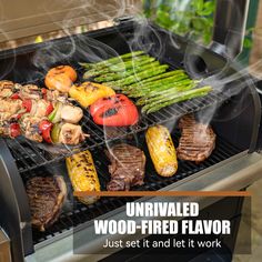 an outdoor grill with vegetables and meat on it