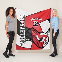 two women standing next to each other in front of a banner that says jacksonville volleyball