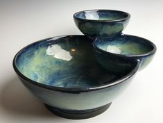 three bowls are stacked on top of each other