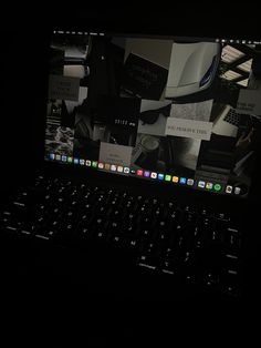 an apple laptop computer sitting on top of a black table next to a mouse and keyboard