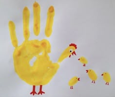 an image of a child's handprint made to look like chickens and chicks