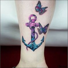 an anchor and butterfly tattoo on the ankle