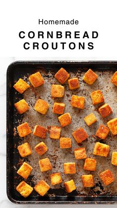 homemade cornbread croutons on a baking sheet with text overlay that reads homemade cornbread croutons