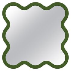 a green scalloped frame mirror on a white background with an empty space in the middle