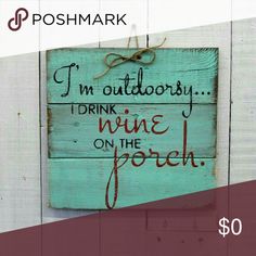 a wooden sign that says i'm outdoorsy, drink wine on the porch