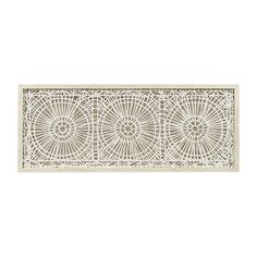 an intricately designed wall panel in white