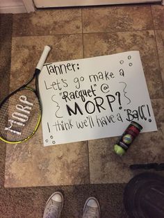 a tennis racquet sitting on the ground next to a sign that says,'trainer let's go make a raguett morp i think we have a ball