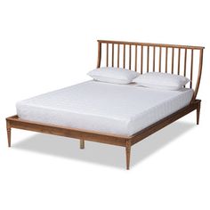 a wooden bed frame with two pillows on it