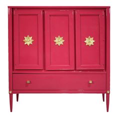 a red cabinet with gold stars on the doors