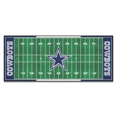 the nfl football field runner rug with cowboys logo on it, in blue and green