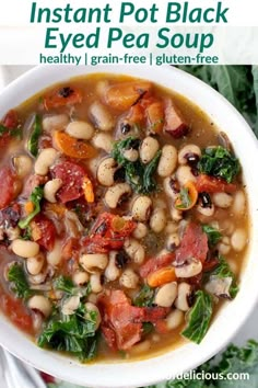 two white bowls filled with beans and greens