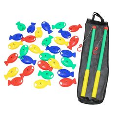 a bag filled with plastic fish next to some markers