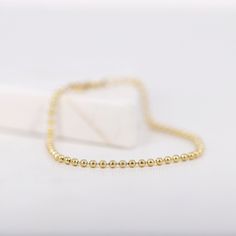 "14K Solid Gold Ball Chain Bracelet, 2mm Gold Beads Bracelet, Simple Minimalist Bracelet, Layering Bracelets, Gifts for Her ≫ Product Details ◈ Handmade / Handcrafted Fine Jewelry ◈ Thickness: 2.0 mm ◈ Metal: Solid 14K Gold ◈ Chain Length: 6\" ~ 7.5\" ≫ Please read our FAQ below for more detail." Minimalist Ball Chain Bracelet As Gift, Minimalist Gold Bracelet With Ball Chain, Minimalist Ball Chain Bracelet Gift, Minimalist Yellow Gold Chain Bracelet With Round Beads, Minimalist Ball Chain Bracelets As Gift, Minimalist Ball Chain Bracelets For Everyday, Minimalist Satellite Chain Bracelet With Round Beads, Minimalist Ball Chain Bracelet, Minimalist Everyday Ball Chain Bracelets