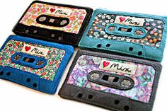 four different colored cassettes with the word love written on them