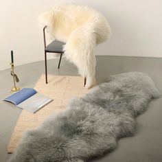 a chair and rug in an empty room