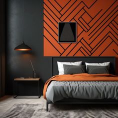 a bedroom with an orange accent wall and black accents on the walls, along with a bed